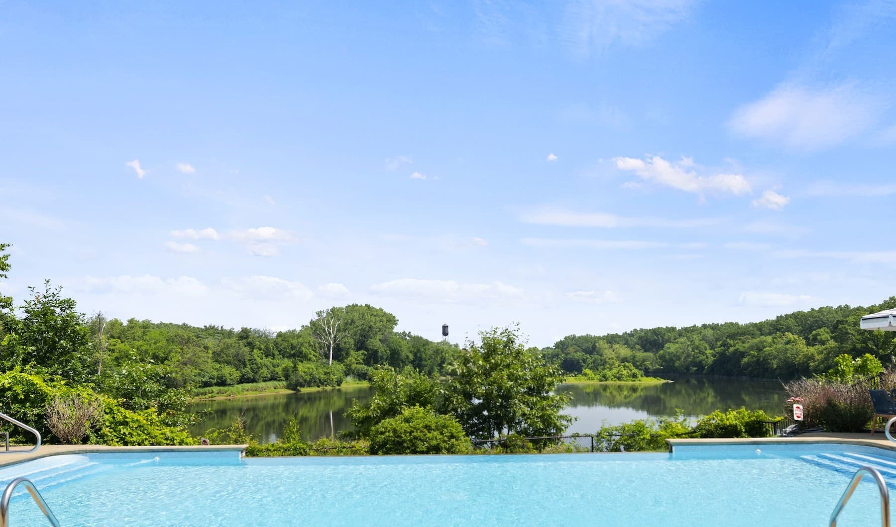 Serenity Awaits You pool outdoors with nearby nature
